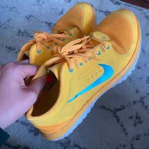 Orange Nike running shoes size 8